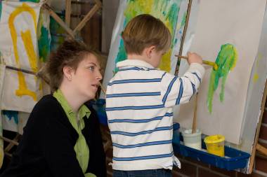 Child painting in QCC's Children's School