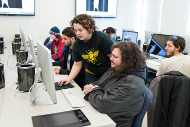 Students collaborate on project in computer lab