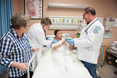 QCC students practice healthcare techniques on patient