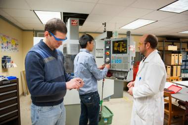 QCC students use manufacturing equipment in lab