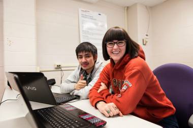 QCC students work on laptops