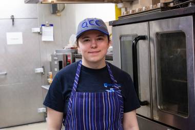 QCC student works in the diner kitchen
