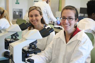 QCC students use microscopes in lab