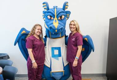 QCC nursing students pose with wyvern